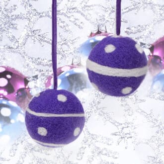 purple needle-felted Christmas baubles with white polka dots and stripes