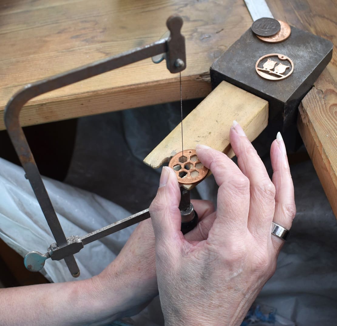 piercing a coin