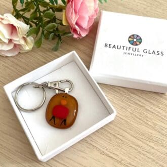 Sweet handmade fused glass robin keyring.