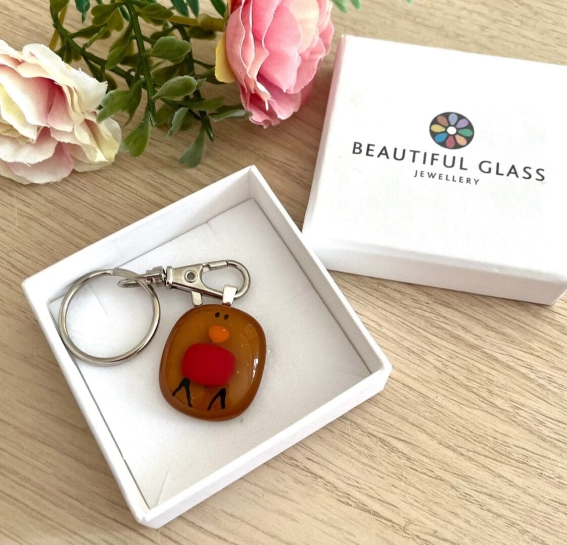 Sweet handmade fused glass robin keyring.