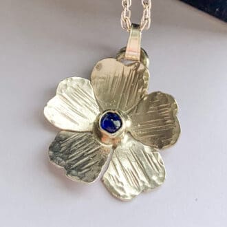 sapphire and silver flower pendant