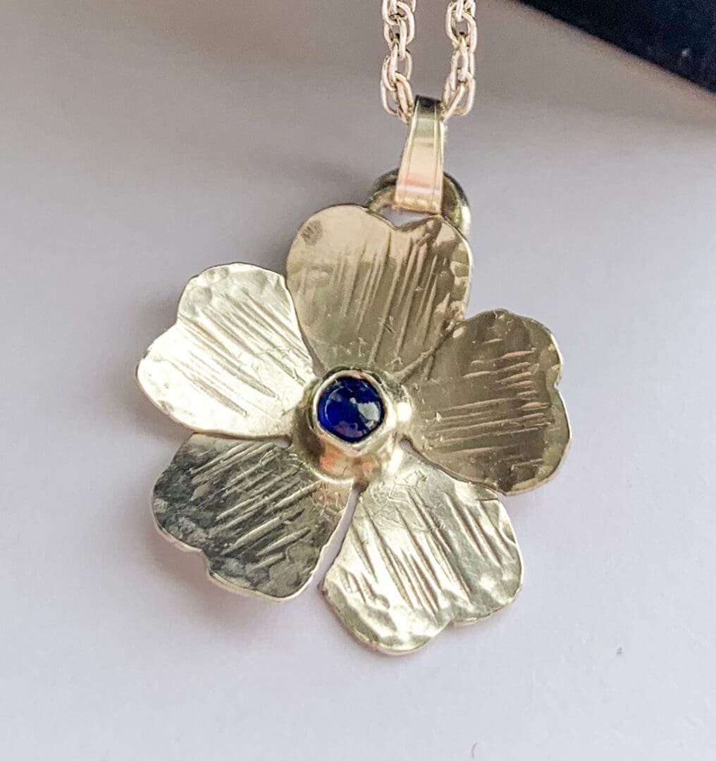 sapphire and silver flower pendant