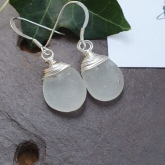 Silver and White sea glass bean drop earrings with silver wire wrap tips and silver hooks