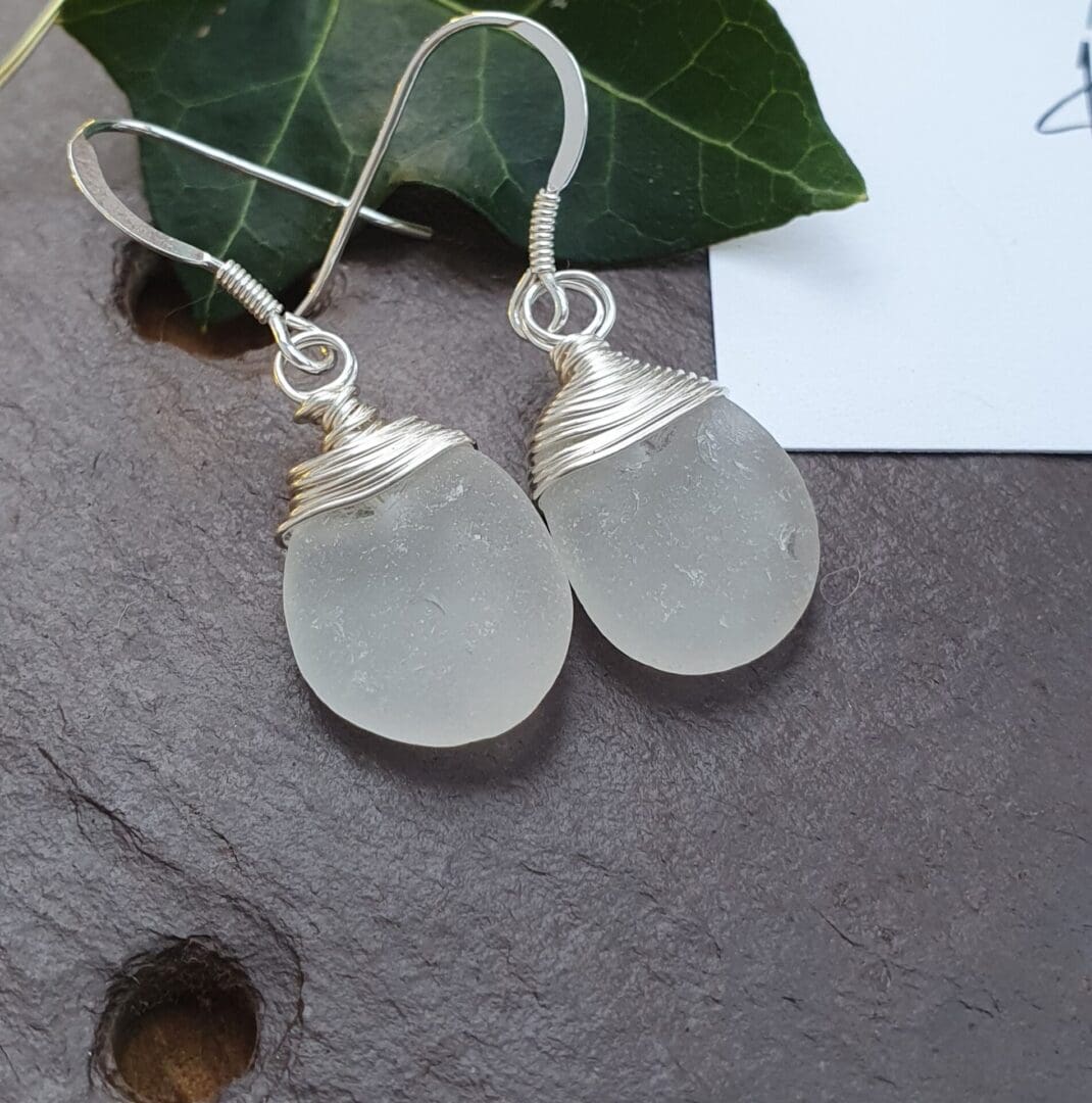 Silver and White sea glass bean drop earrings with silver wire wrap tips and silver hooks