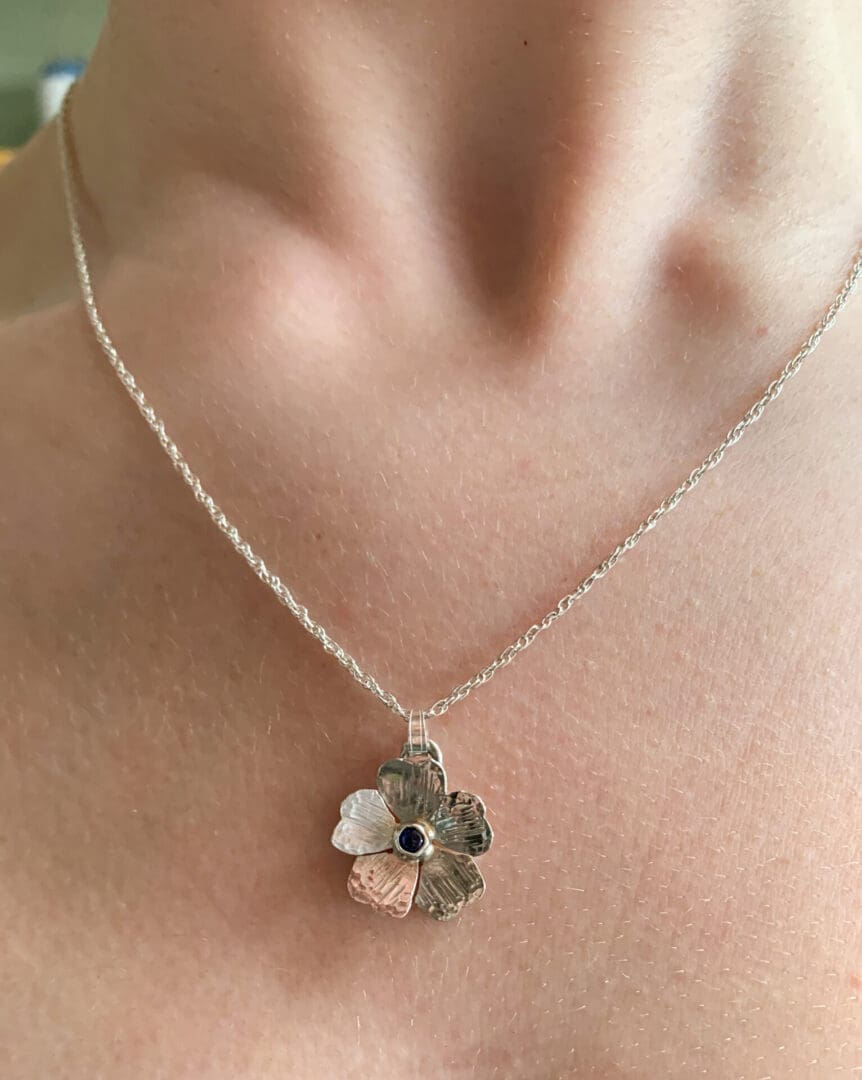 silver and sapphire flower pendant