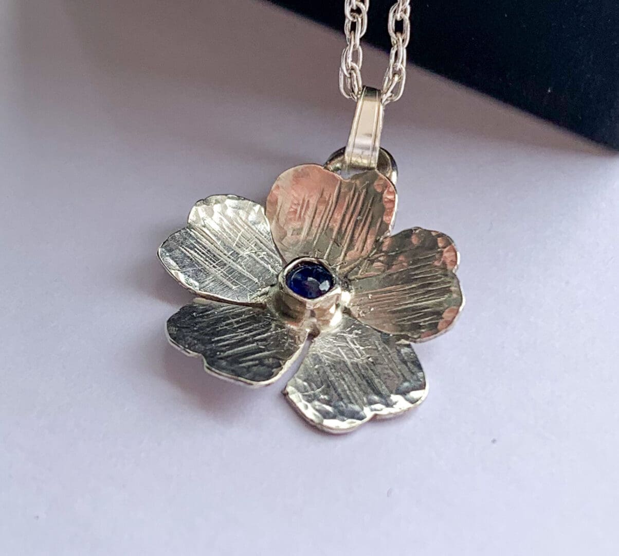 Silver flower pendant