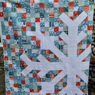 Modern Christmas snowflake patchwork quilt