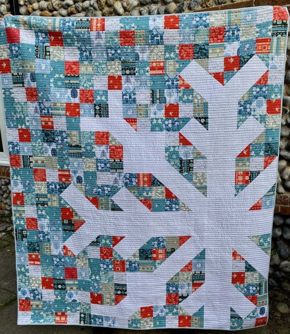 Modern Christmas snowflake patchwork quilt