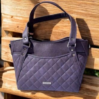 A stylish and spacious handbag for women in a dark grape colour faux leather