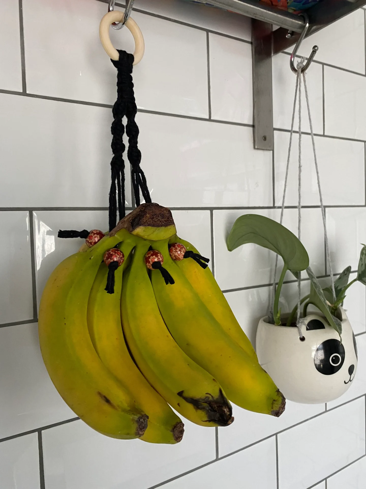 Hanging banana holder made with recycled cotton and wooden beads