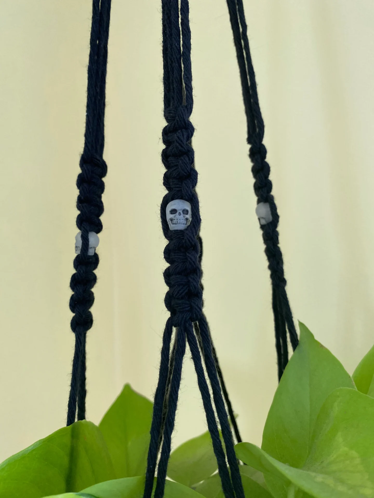 Macrame plant hanger, made with recycled cotton and skull beads