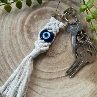 Evil eye bead macrame keychain made with recycled cotton and a resin bead, on a metal lobster clasp