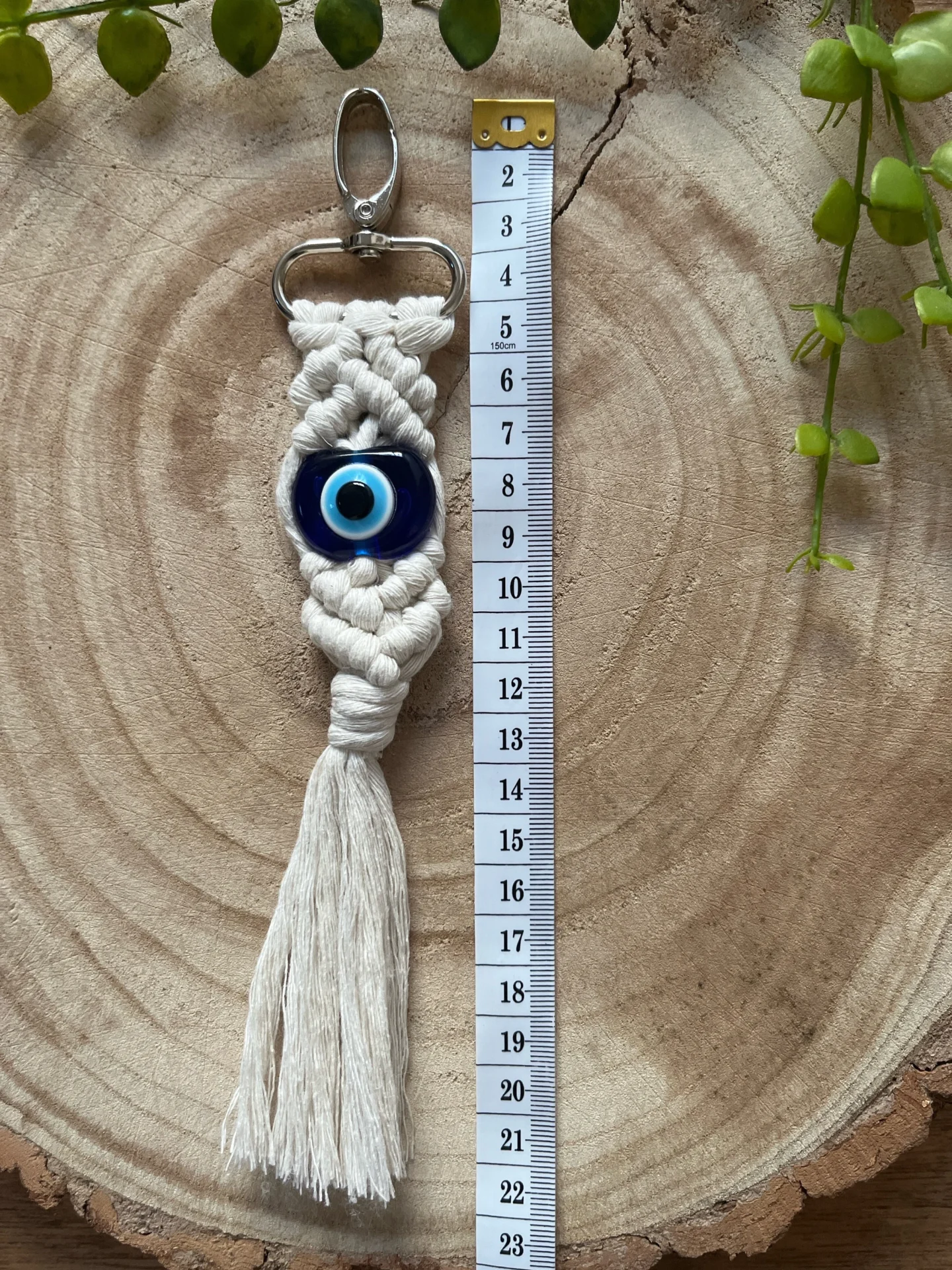 Evil eye bead macrame keychain made with recycled cotton and a resin bead, on a metal lobster clasp