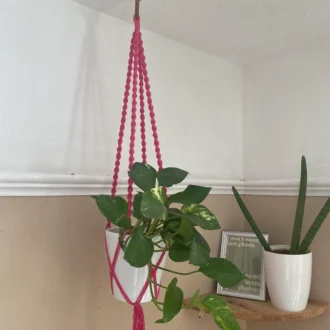 Twisted macrame plant hanger made with fuchsia pink recycled cotton