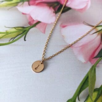 gold filled 9mm discs hand-stamped with an initial on a gold-filled trace chain necklace