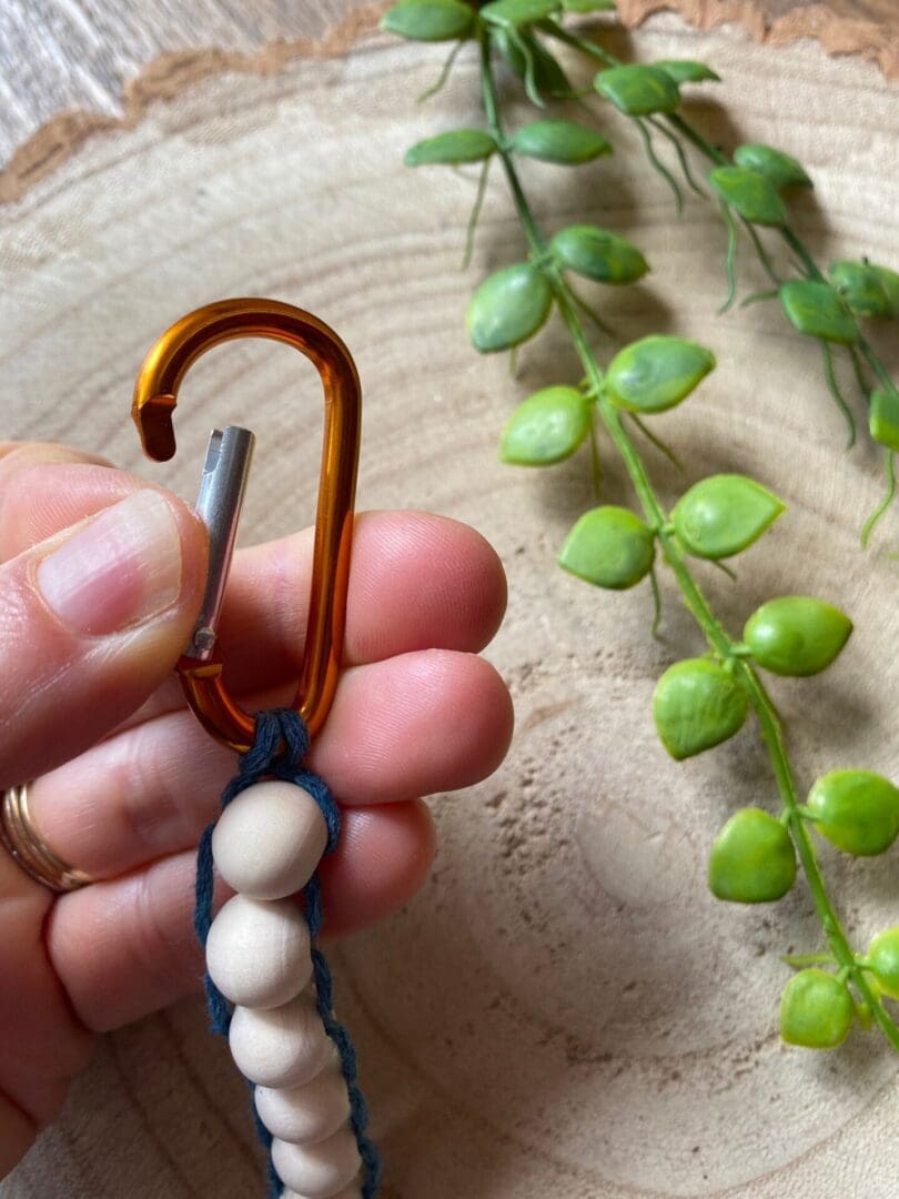 Golf Stroke counter made with recycled cotton, and wooden beads on a carabiner clip