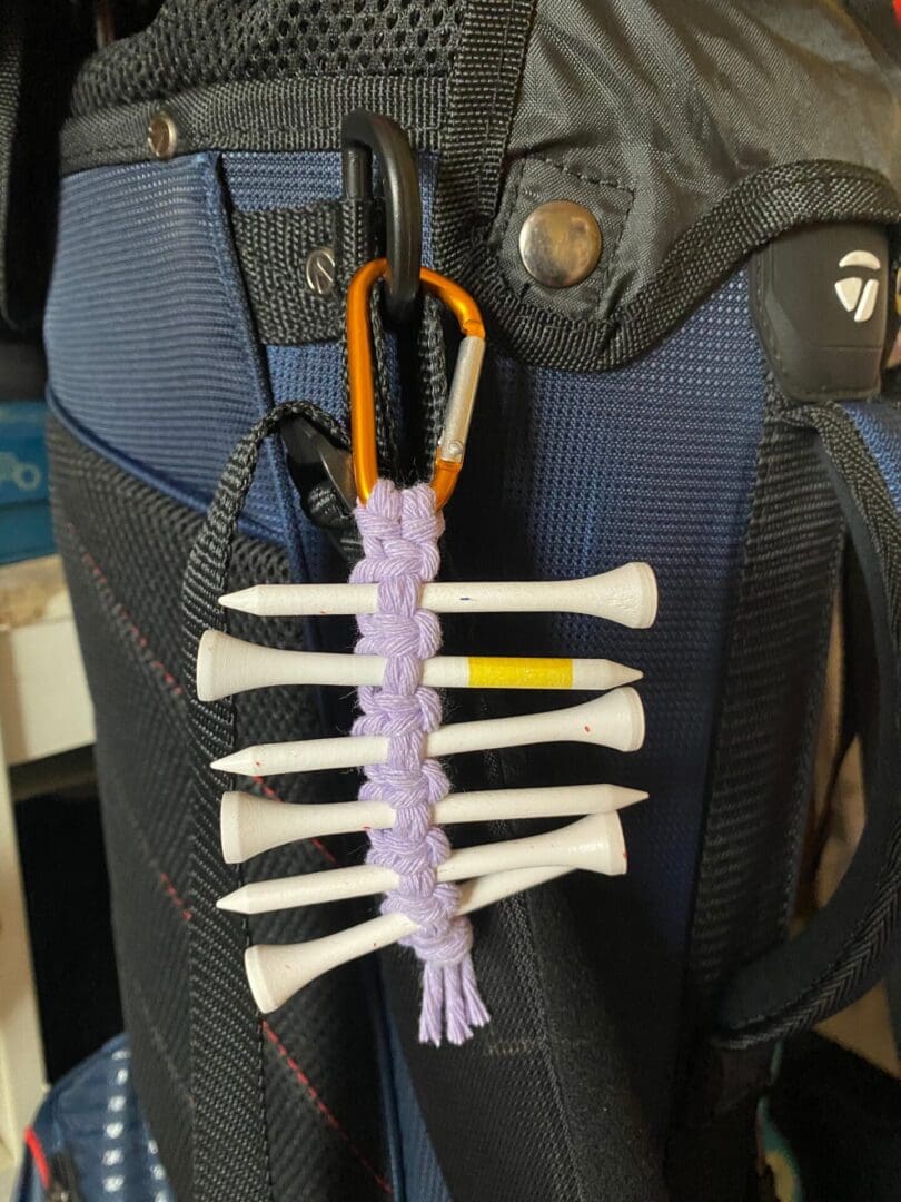 Golf tee holder, handmade with recycled yarn on a carabiner clip