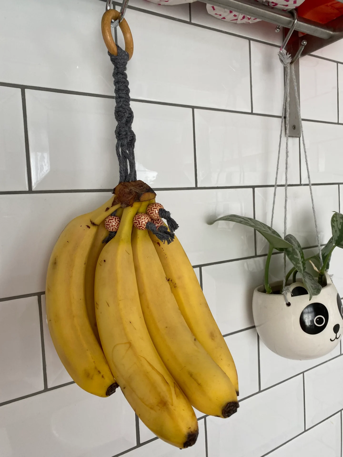 Hanging banana holder made with recycled cotton and wooden beads