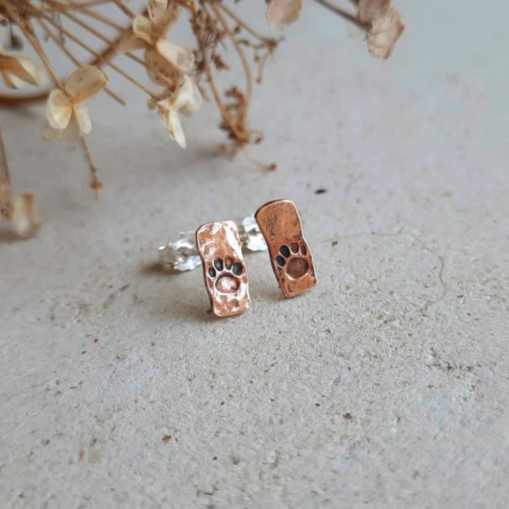 Copper pawprint post earrings, hand crafted by The Tiny Tree Frog Jewellery