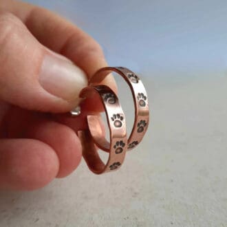 Hand stamped copper paw print hoop stud earrings, hand crafted by The Tiny Tree Frog Jewellery