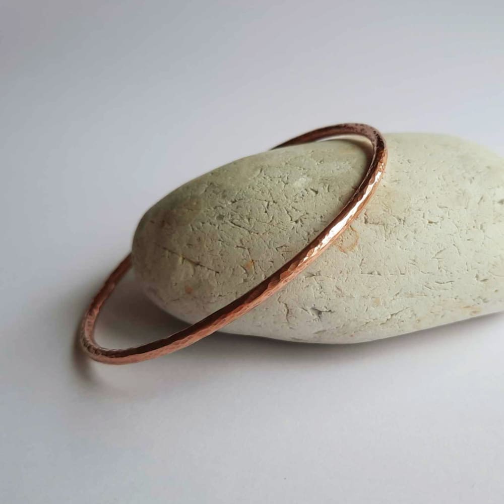 Hammered copper bangle, handcrafted by The Tiny Tree Frog Jewellery