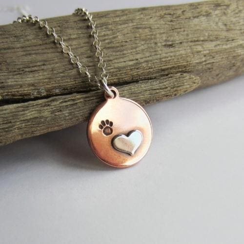 Heart and paw print mixed metal copper and sterling silver necklace, handmade by The Tiny Tree Frog Jewellery