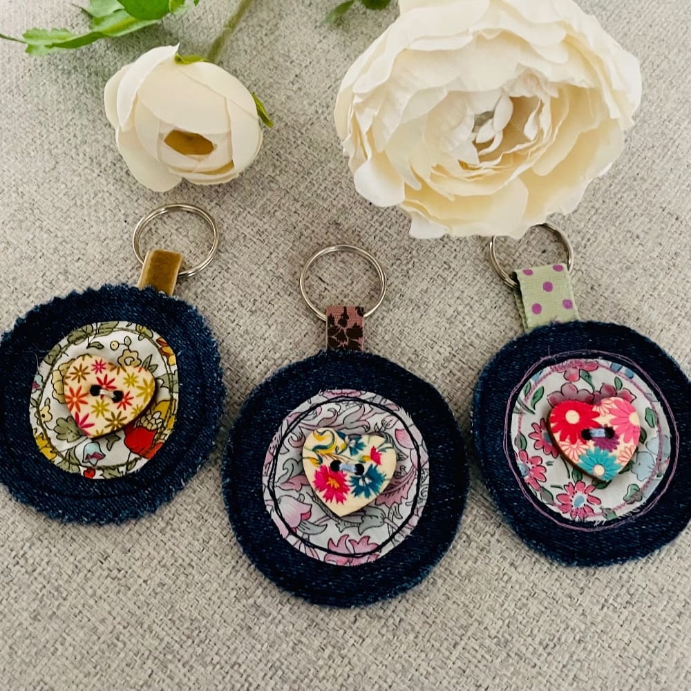 Handmade keyring or bag charm with a mix of funky colours, featuring liberty fabrics and denim fabric. Vibrant and stylish accessory for bags and keys