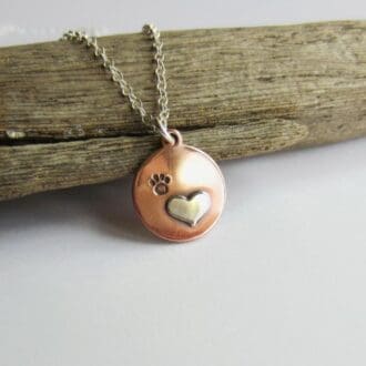 Copper and sterling silver paw print and love heart pendant necklace, handmade by The Tiny Tree Frog Jewellery