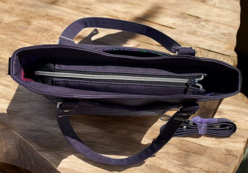 Top view of ladies grape handbag showing zip