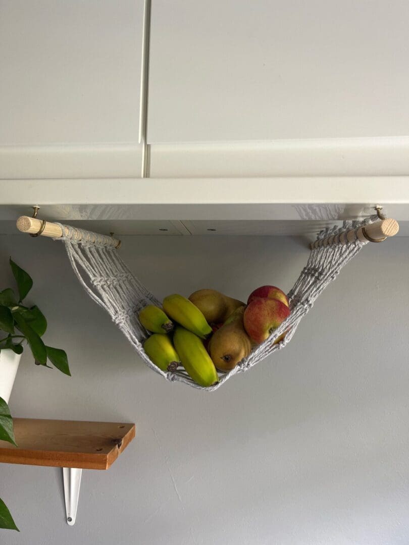 Under cabinet space saving fruit hammock made with light grey recycled cotton