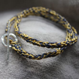 light maize and navy crocheted bracelet with sterling silver toggle and t bar findings