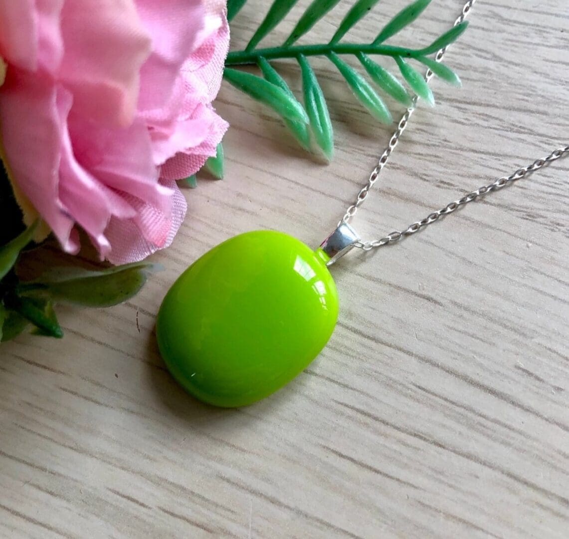 Bright lime green tropical fused glass pendant on silver chain