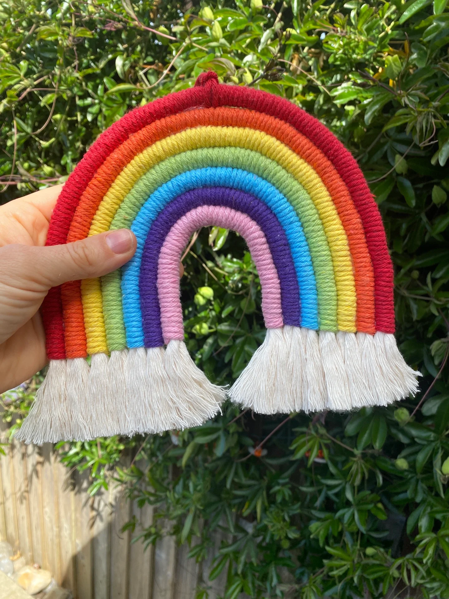 Macrame rainbow wall hanging decoration, made with 7 vibrant colours of recycled cotton