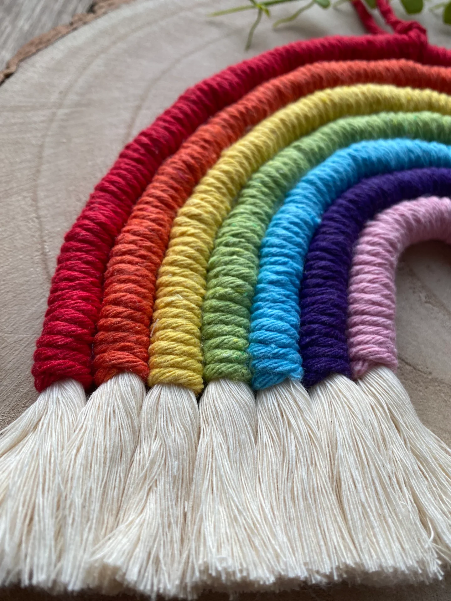 Macrame rainbow wall hanging decoration, made with 7 vibrant colours of recycled cotton