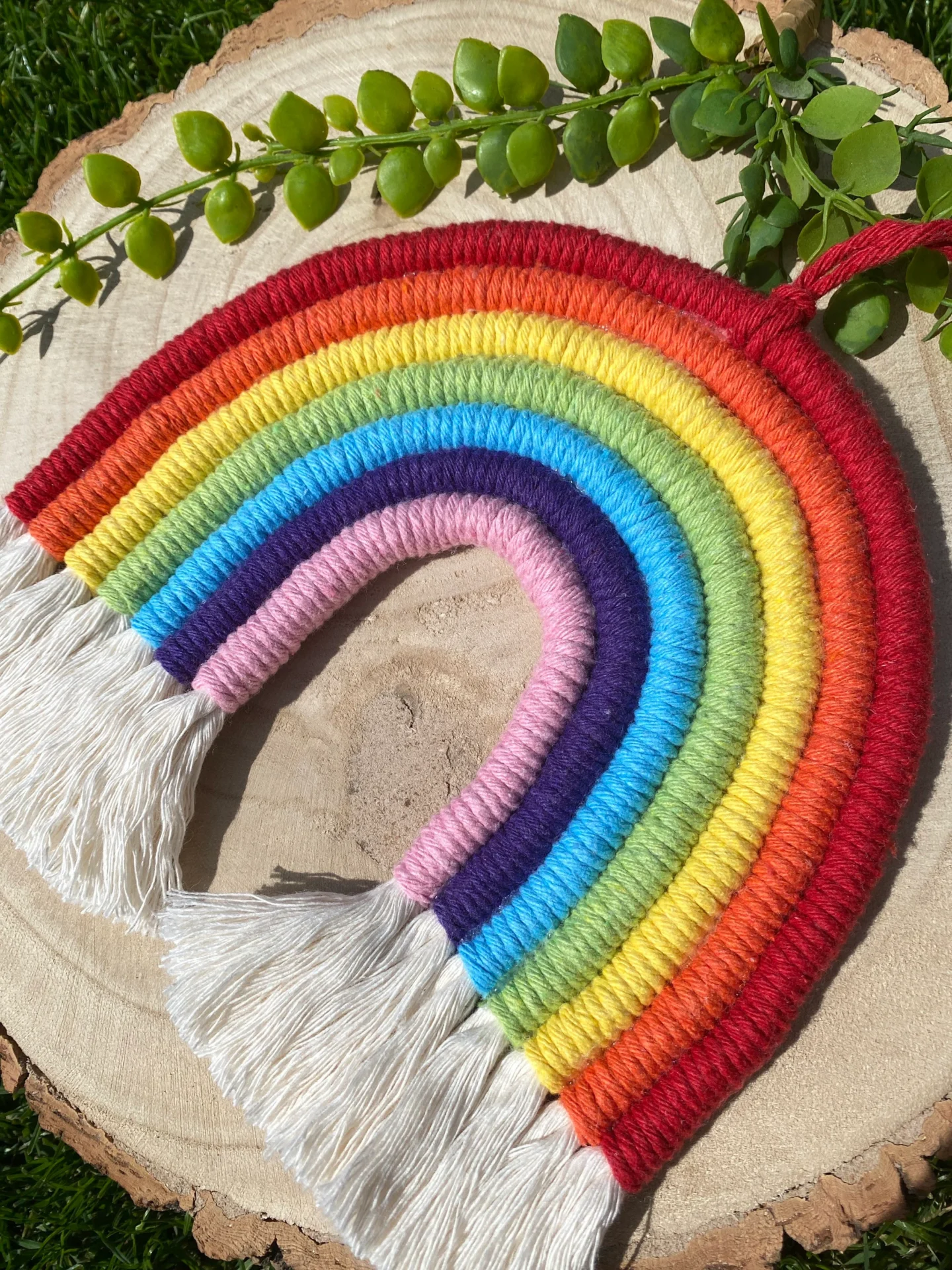 Macrame rainbow wall hanging decoration, made with 7 vibrant colours of recycled cotton