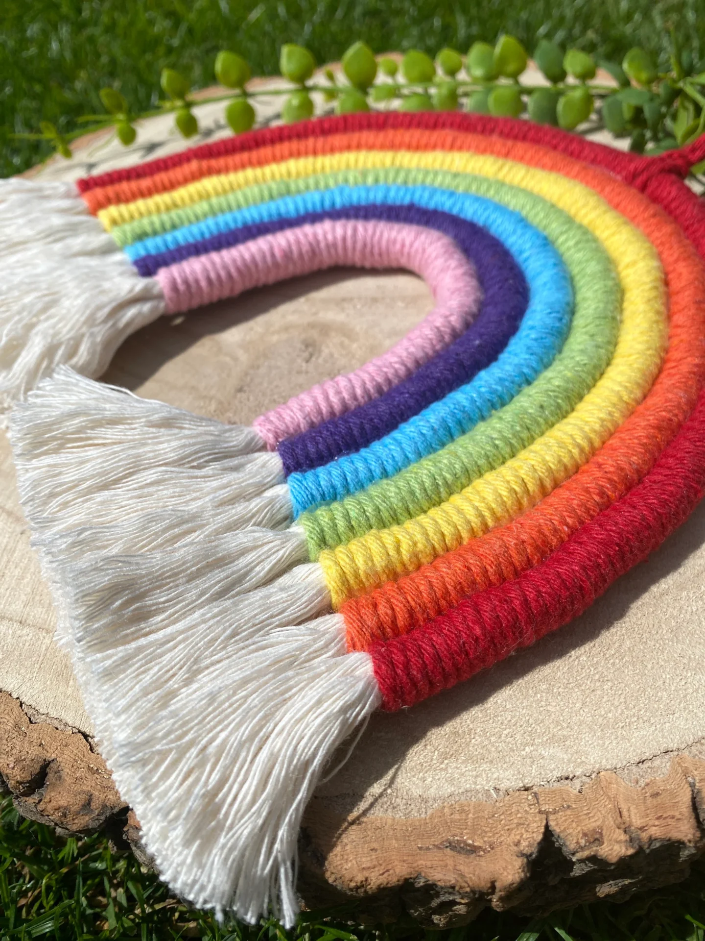 Macrame rainbow wall hanging decoration, made with 7 vibrant colours of recycled cotton