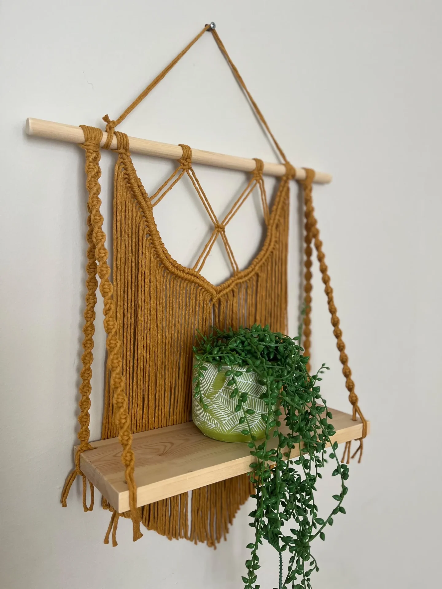 Macrame wall hanging shelf made with mustard yellow recycled cotton