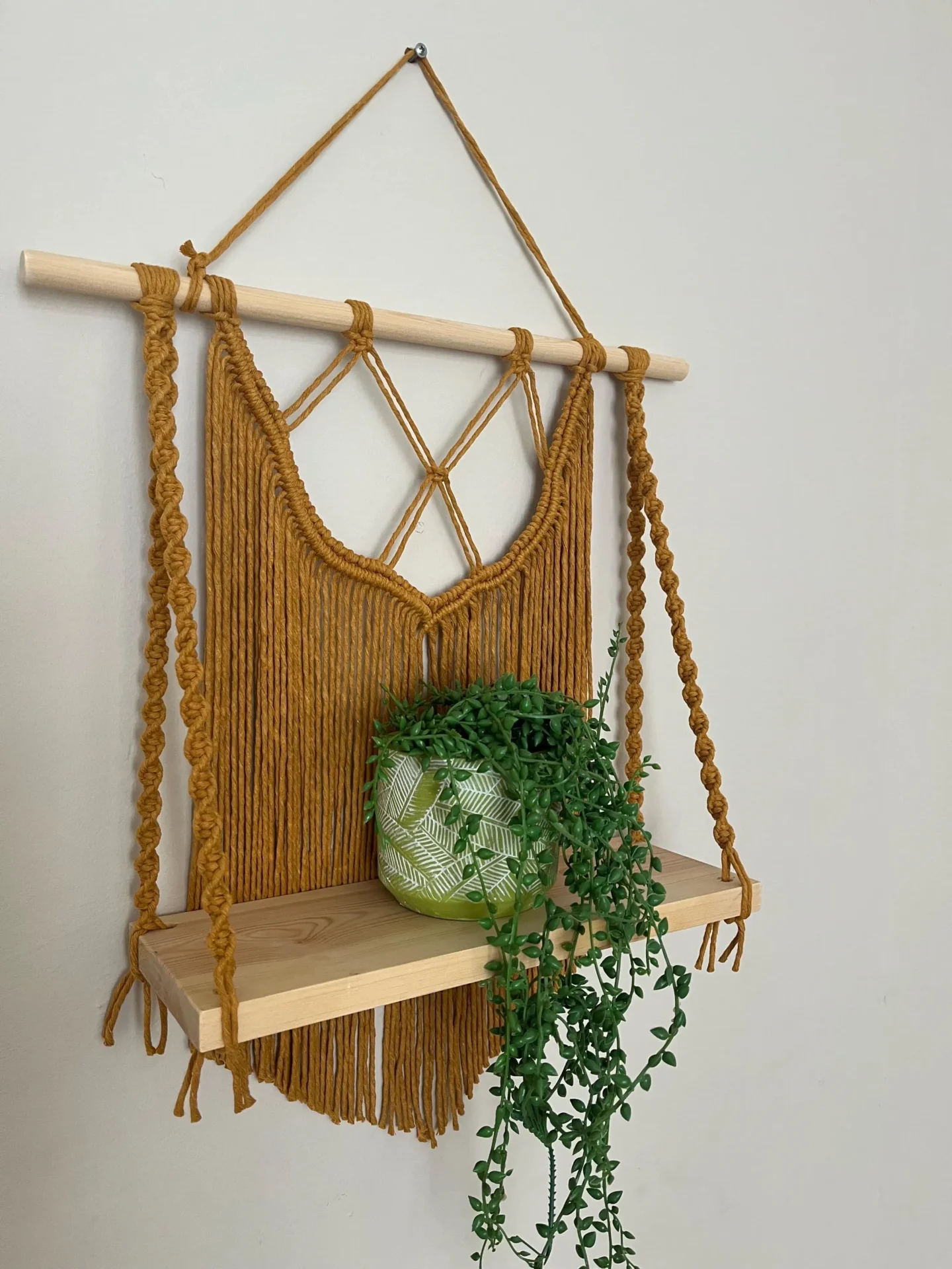 Macrame wall hanging shelf made with mustard yellow recycled cotton