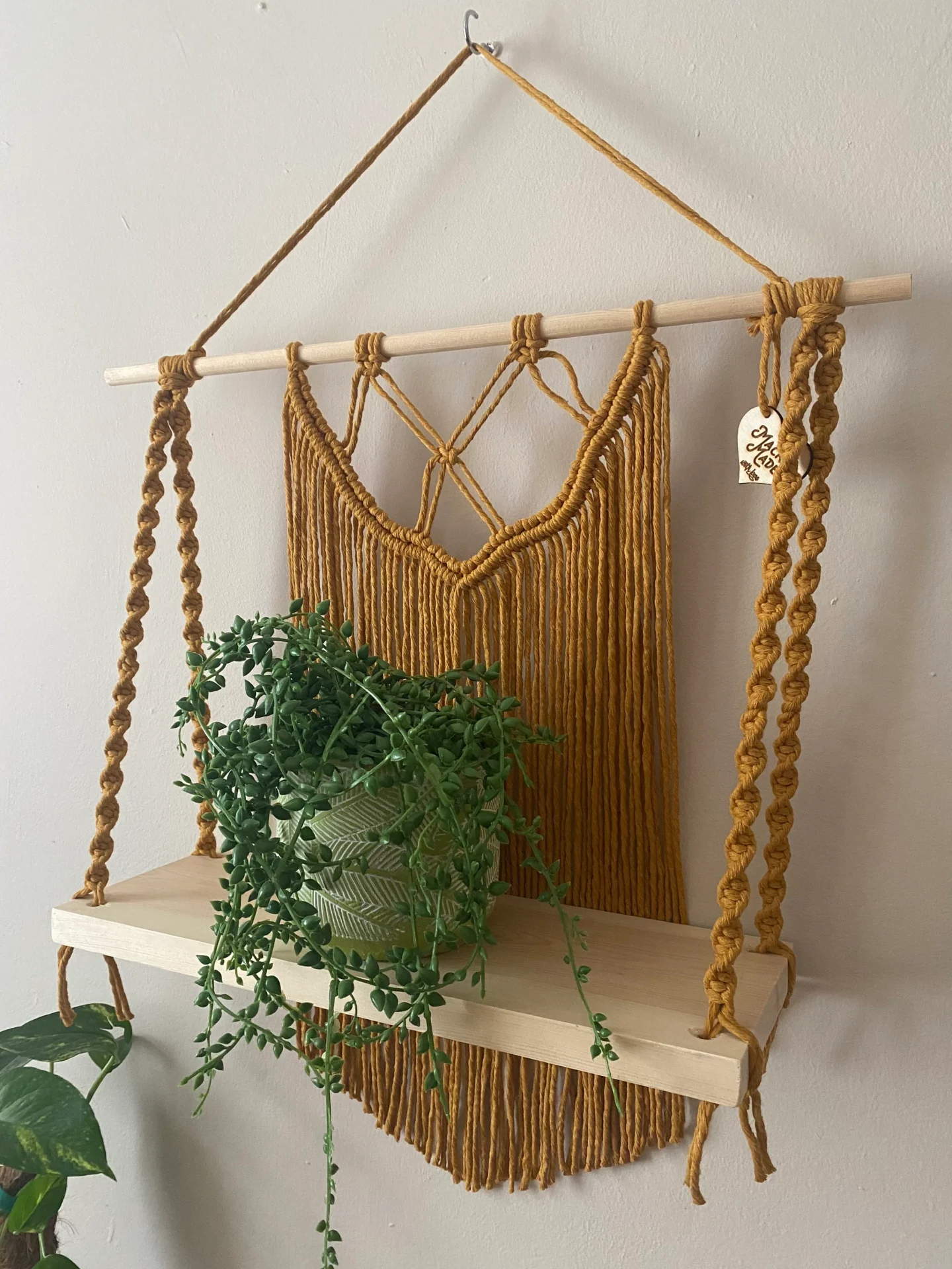 Macrame wall hanging shelf made with mustard yellow recycled cotton