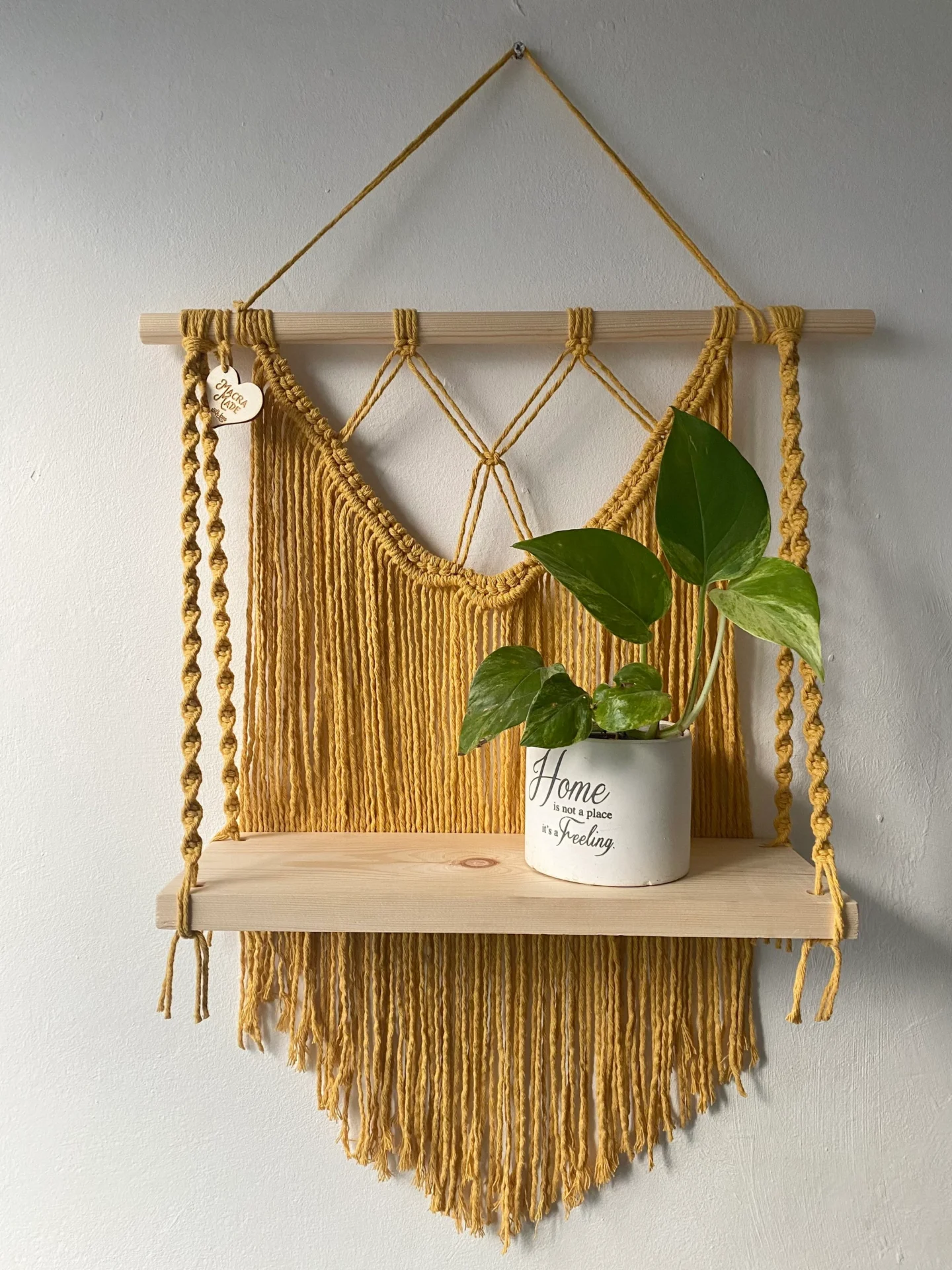 Macrame wall hanging shelf made with mustard yellow recycled cotton