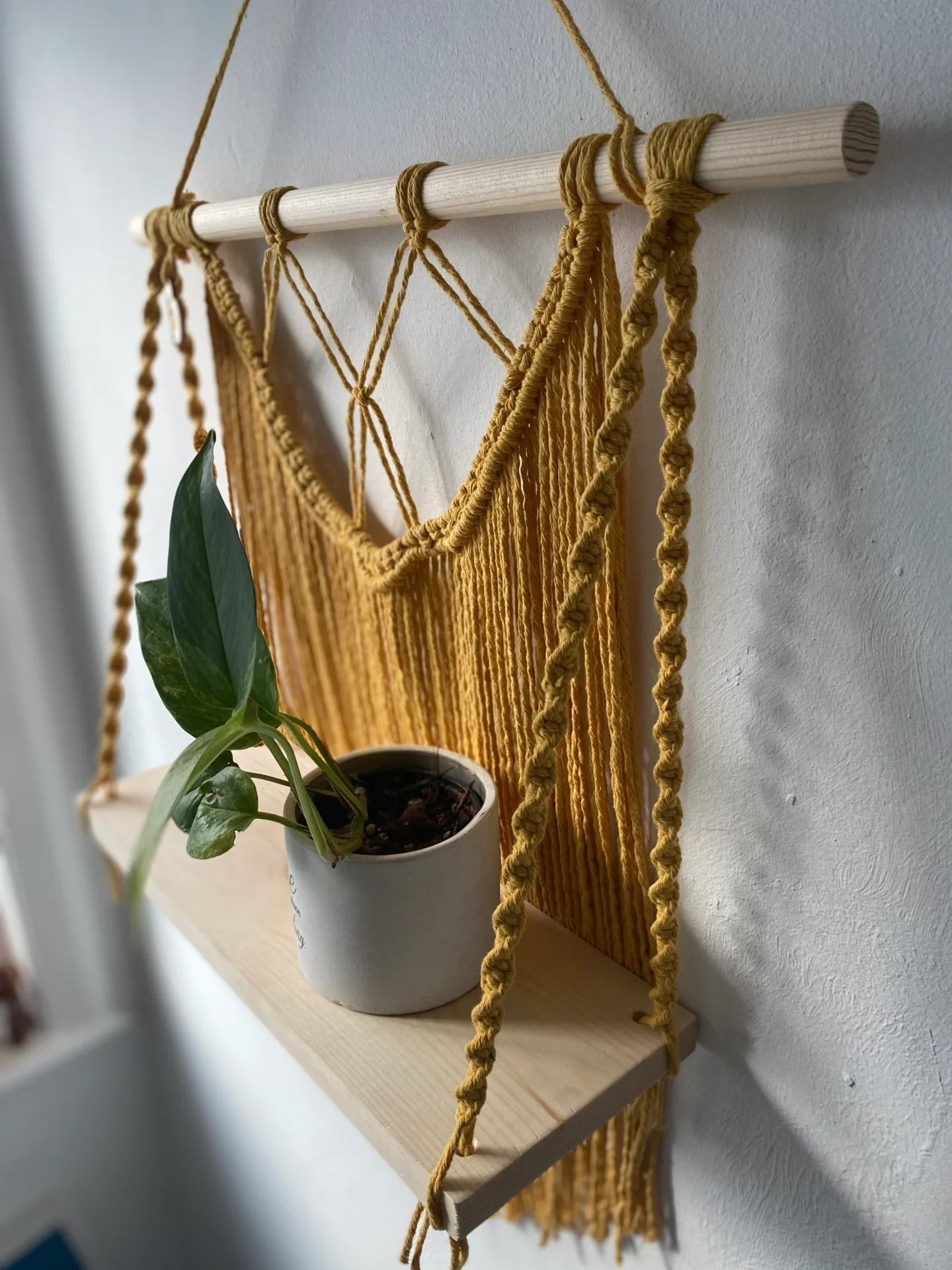 Macrame wall hanging shelf made with mustard yellow recycled cotton