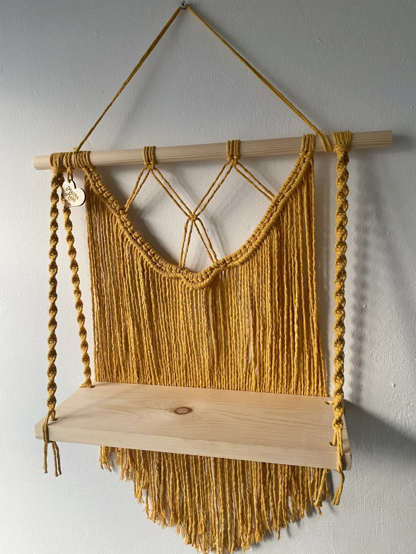 Macrame wall hanging shelf made with mustard yellow recycled cotton