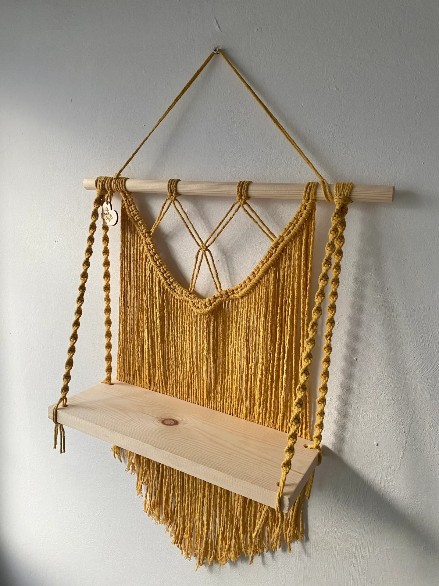 Macrame wall hanging shelf made with mustard yellow recycled cotton