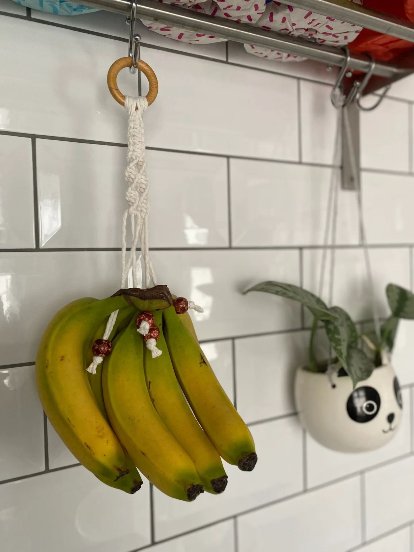 Hanging banana holder made with recycled cotton and wooden beads