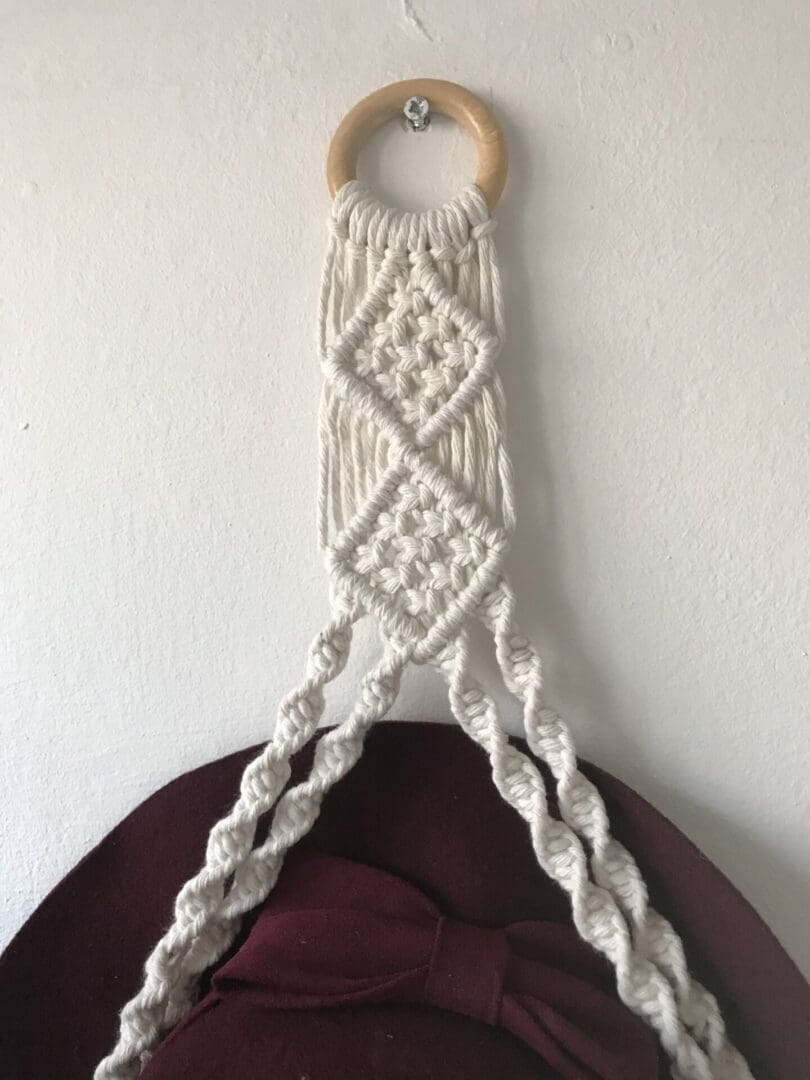 Macrame wall hanging hat holder, made with recycled cotton