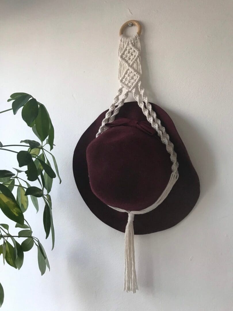 Macrame wall hanging hat holder, made with recycled cotton