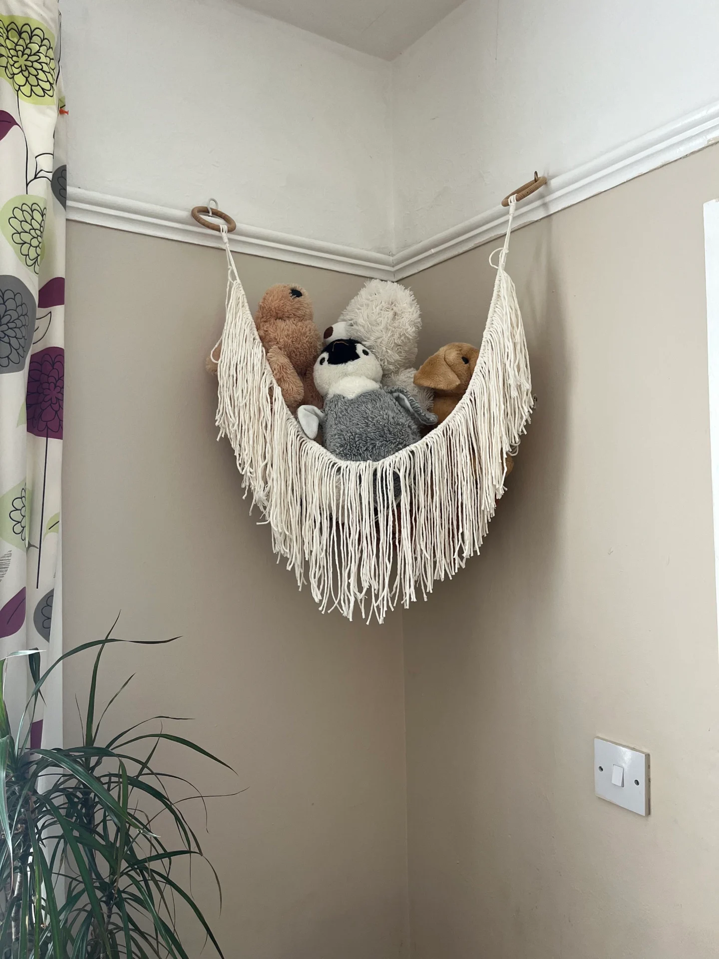 Soft toy storage corner hammock, made with natural recycled cotton.