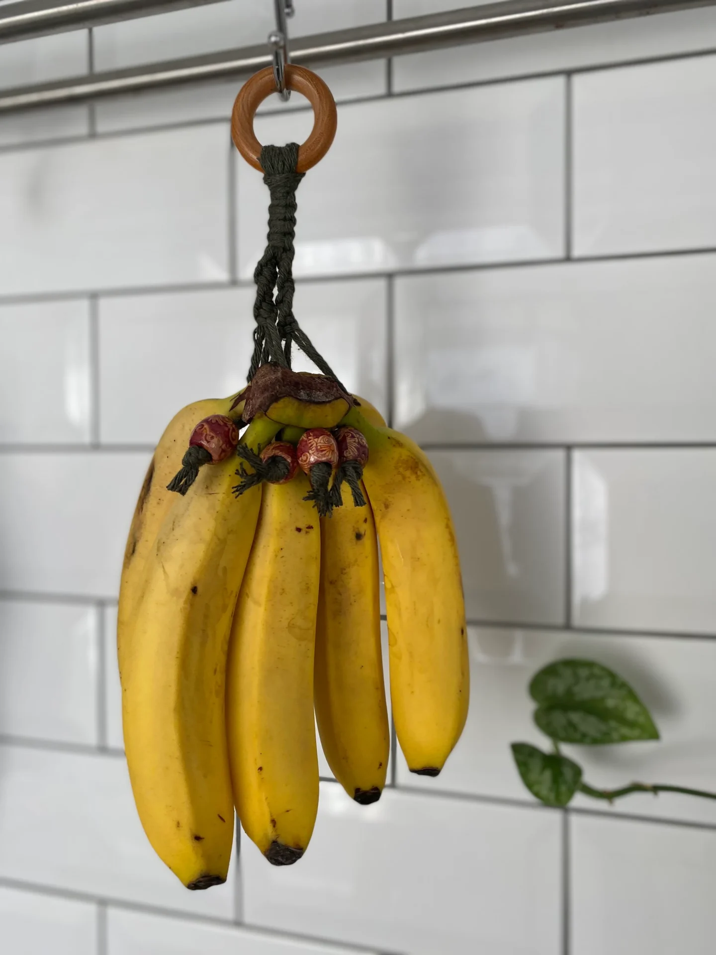 Hanging banana holder made with recycled cotton and wooden beads