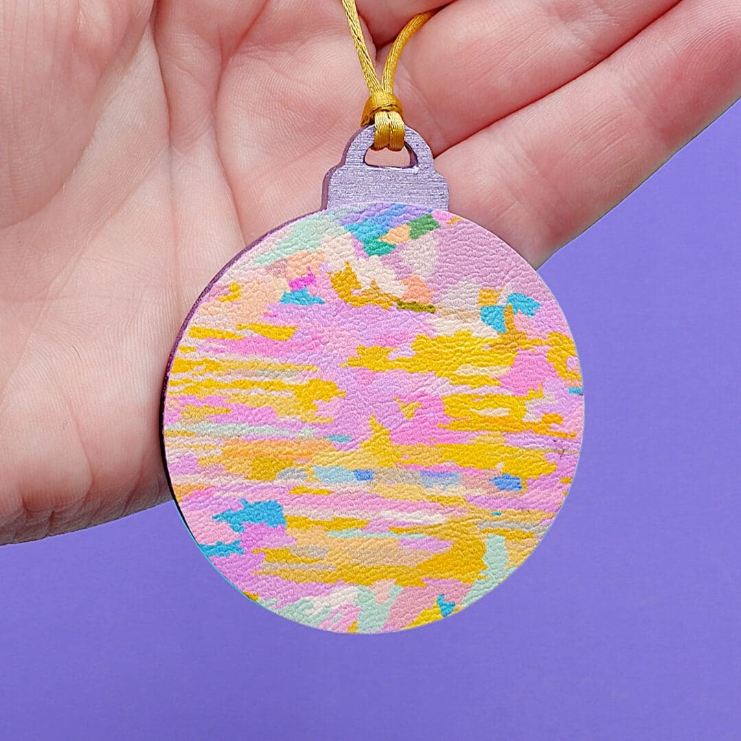 Yellow and pink Abstract art fabric and wood Christmas decoration.