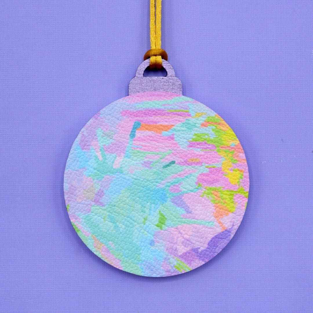 Pastel rainbow painted effect faux leather and wood Christmas bauble.